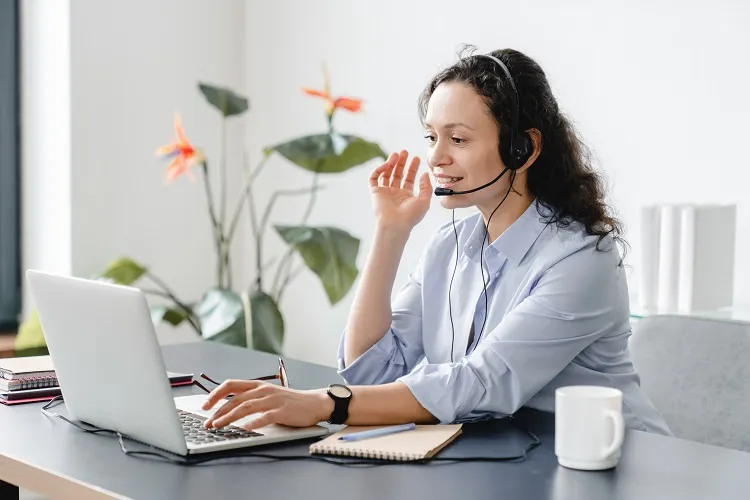 A woman making a phone call on headset