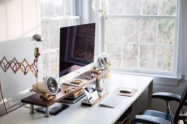 clean office desk at home with speakers