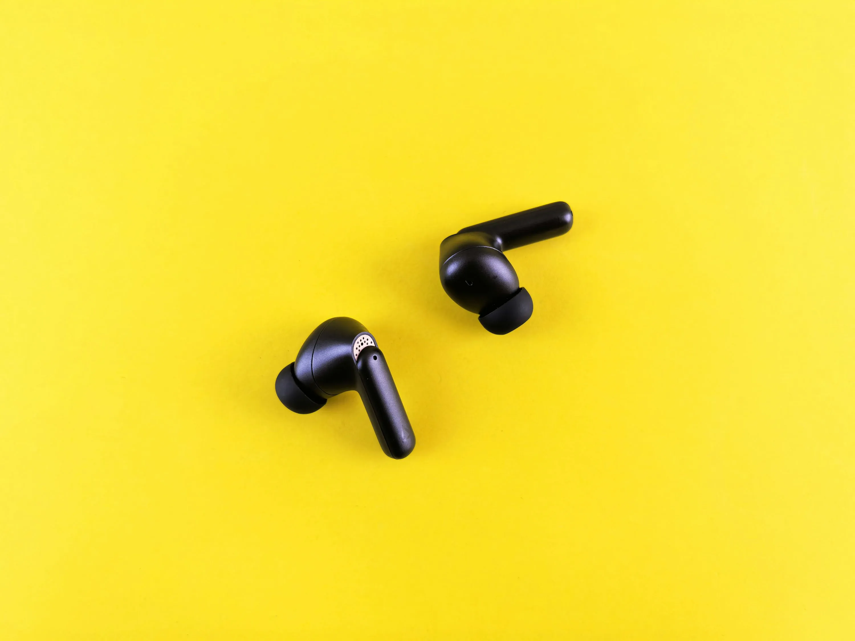 A pair of wireless noise-canceling earbuds