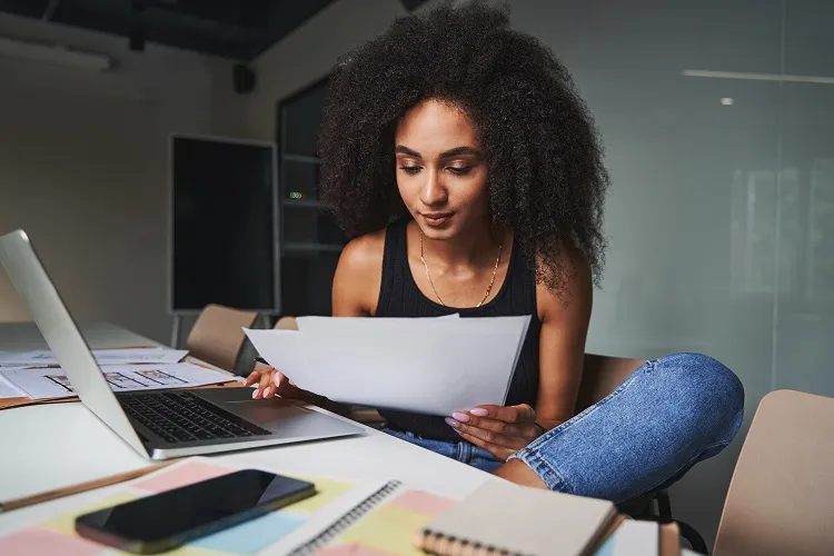 a woman working on her online portfolio